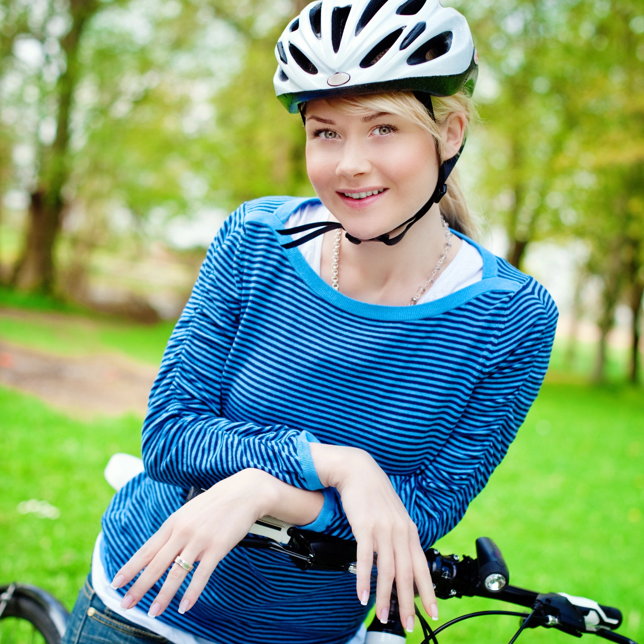 Portrait of a cyclist with bicycle and helmet