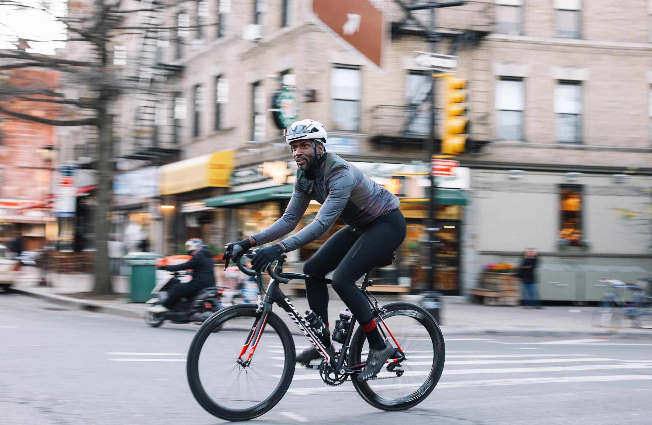 Cyclist commuting in the city wearing safety-focused riding gear