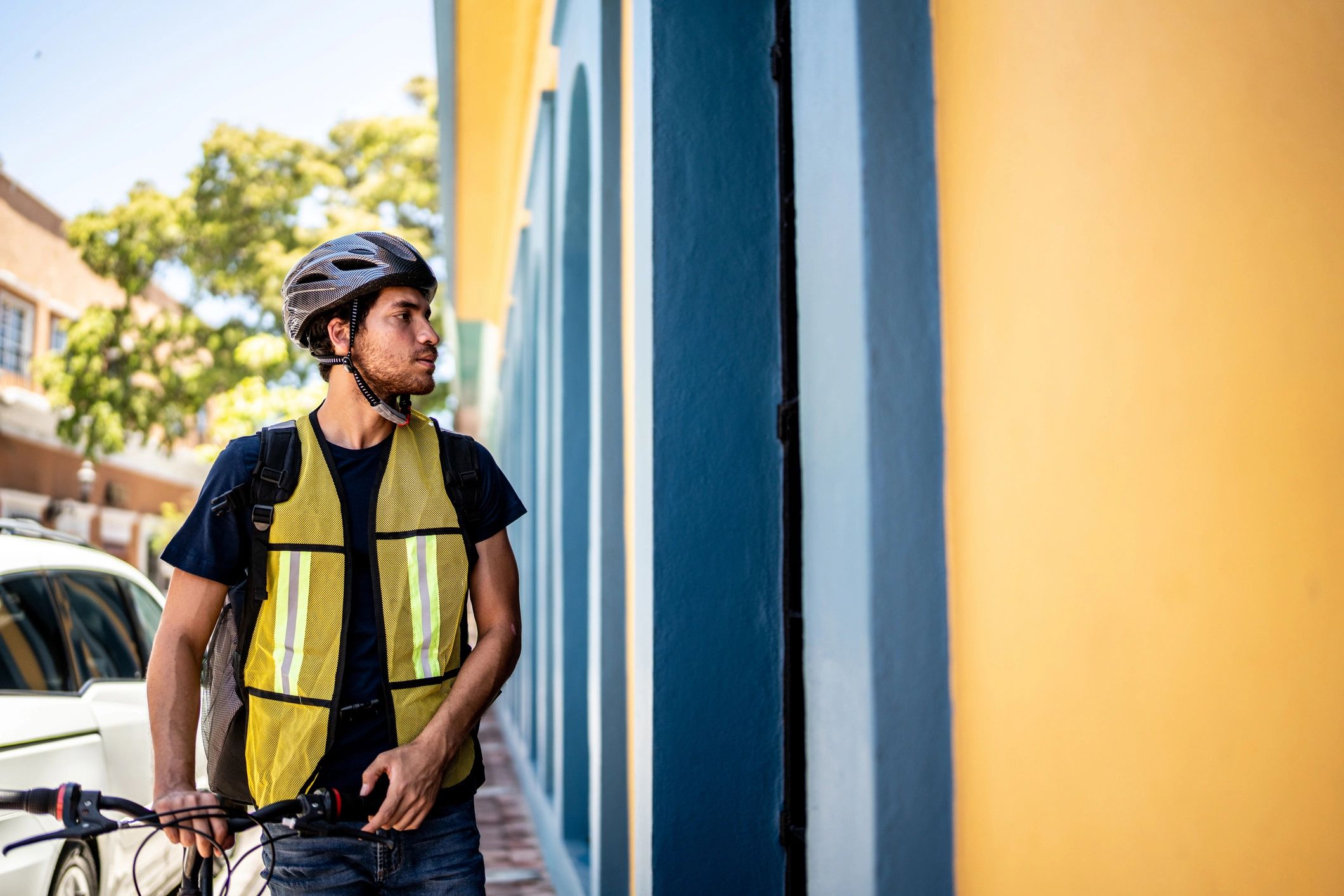 Bike courier with gear outdoors